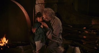 Movie still from “Black Sabbath” (1963), directed by Mario Bava – An old man and a young boy in a cave; Medium shot, Over the shoulder angle