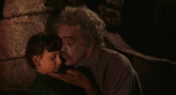 Movie still from “Black Sabbath” (1963), directed by Mario Bava – An older man and a young boy in a cave; Close Up shot, Low angle