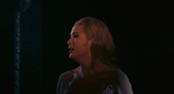 Movie still from “Black Sabbath” (1963), directed by Mario Bava – A woman with long blonde hair looking to her left; Close Up shot, Over the shoulder angle