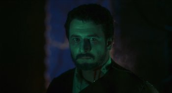 Movie still from “Black Sabbath” (1963), directed by Mario Bava – A person wearing a black shirt; Close Up shot, Low angle