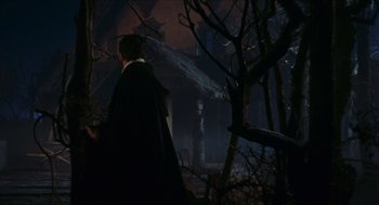 Movie still from “Black Sabbath” (1963), directed by Mario Bava – A man walking through a dark forest at night; Wide shot, Low angle