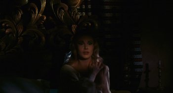 Movie still from “Black Sabbath” (1963), directed by Mario Bava – A beautiful woman with blonde hair wearing a white dress; Medium shot, Over the shoulder angle