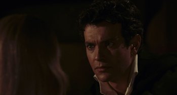 Movie still from “Black Sabbath” (1963), directed by Mario Bava – A person wearing a suit and tie; Close Up shot, Over the shoulder angle