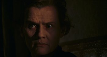 Movie still from “Black Sabbath” (1963), directed by Mario Bava – A person's face in the dark; Close Up shot, Over the shoulder angle