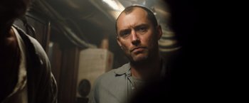 Movie still from “Black Sea” (2014), directed by Kevin Macdonald – A person in a room; Close Up shot, Low angle