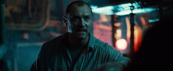 Movie still from “Black Sea” (2014), directed by Kevin Macdonald – A person wearing a shirt; Close Up shot, Low angle