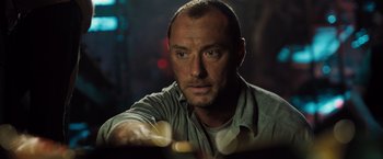 Movie still from “Black Sea” (2014), directed by Kevin Macdonald – A person holding something in his hand; Close Up shot, Low angle