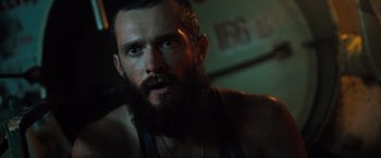 Movie still from “Black Sea” (2014), directed by Kevin Macdonald – A person with a beard; Close Up shot, Low angle