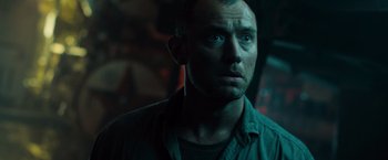 Movie still from “Black Sea” (2014), directed by Kevin Macdonald – A person looking at the camera; Close Up shot, Low angle