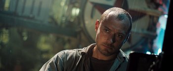 Movie still from “Black Sea” (2014), directed by Kevin Macdonald – A person wearing a shirt; Close Up shot, Low angle