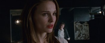 Movie still from “Black Swan” (2010), directed by Darren Aronofsky – A person looking at the camera; Close Up shot, Over the shoulder angle