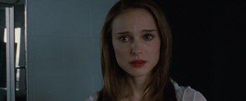 Movie still from “Black Swan” (2010), directed by Darren Aronofsky – A person with long brown hair; Close Up shot, Over the shoulder angle