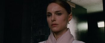 Movie still from “Black Swan” (2010), directed by Darren Aronofsky – A person wearing a white shirt; Close Up shot, Over the shoulder angle