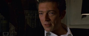 Movie still from “Black Swan” (2010), directed by Darren Aronofsky – A person wearing a suit and tie; Close Up shot, High angle