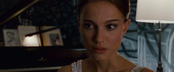 Movie still from “Black Swan” (2010), directed by Darren Aronofsky – A person wearing a white dress; Close Up shot, Over the shoulder angle