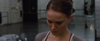 Movie still from “Black Swan” (2010), directed by Darren Aronofsky – A person wearing a necklace; Close Up shot, Over the shoulder angle
