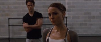 Movie still from “Black Swan” (2010), directed by Darren Aronofsky – A man and a woman standing next to each other; Close Up shot, Over the shoulder angle