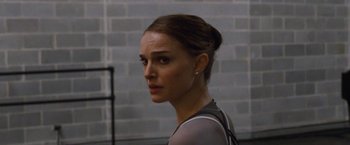 Movie still from “Black Swan” (2010), directed by Darren Aronofsky – A person wearing a shirt; Close Up shot, Over the shoulder angle