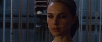 Movie still from “Black Swan” (2010), directed by Darren Aronofsky – A person wearing a white shirt; Close Up shot, Over the shoulder angle