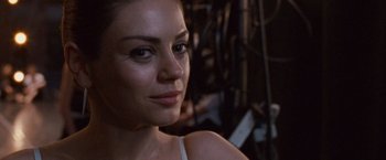 Movie still from “Black Swan” (2010), directed by Darren Aronofsky – A woman's face in front of a bunch of lights; Close Up shot, Over the shoulder angle