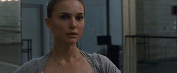 Movie still from “Black Swan” (2010), directed by Darren Aronofsky – A person wearing a necklace; Close Up shot, Over the shoulder angle