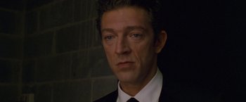 Movie still from “Black Swan” (2010), directed by Darren Aronofsky – A person wearing a suit and tie; Close Up shot, High angle