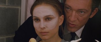Movie still from “Black Swan” (2010), directed by Darren Aronofsky – A person with makeup on their face; Close Up shot, Over the shoulder angle