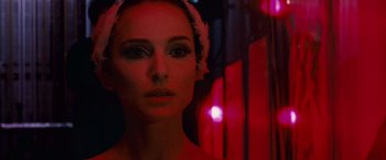 Movie still from “Black Swan” (2010), directed by Darren Aronofsky – A person wearing a towel on their head; Close Up shot, Over the shoulder angle