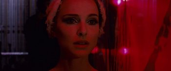 Movie still from “Black Swan” (2010), directed by Darren Aronofsky – A person wearing a white hat; Close Up shot, Low angle