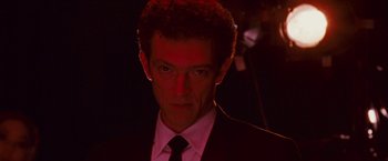Movie still from “Black Swan” (2010), directed by Darren Aronofsky – A person wearing a suit and tie; Close Up shot, Low angle