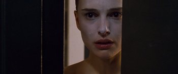 Movie still from “Black Swan” (2010), directed by Darren Aronofsky – A woman looking into a mirror; Extreme Close Up shot, Over the shoulder angle