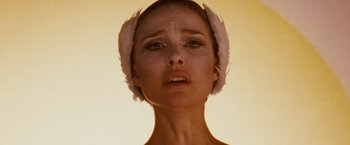 Movie still from “Black Swan” (2010), directed by Darren Aronofsky – A person wearing a headband; Close Up shot, Low angle