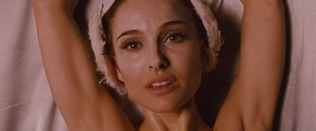 Movie still from “Black Swan” (2010), directed by Darren Aronofsky – A person wearing a towel on their head; Close Up shot, Overhead angle