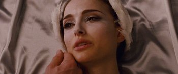Movie still from “Black Swan” (2010), directed by Darren Aronofsky – A person with makeup on; Close Up shot, Over the shoulder angle