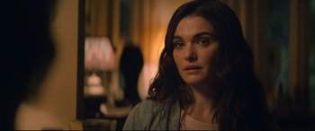 Movie still from “Black Widow” (2021), directed by Cate Shortland – A person with long brown hair; Close Up shot, Over the shoulder angle