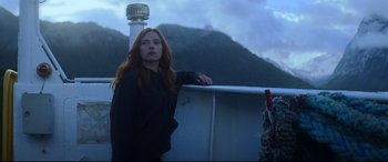 Movie still from “Black Widow” (2021), directed by Cate Shortland – A woman standing next to a railing on top of a boat; Medium shot, Low angle
