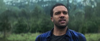 Movie still from “Black Widow” (2021), directed by Cate Shortland – A person wearing a blue shirt; Close Up shot, Over the shoulder angle