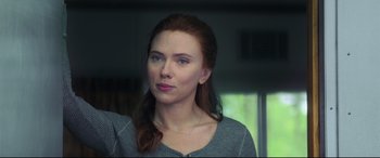 Movie still from “Black Widow” (2021), directed by Cate Shortland – A person with long red hair; Close Up shot, Over the shoulder angle