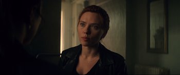 Movie still from “Black Widow” (2021), directed by Cate Shortland – A person wearing a black jacket; Close Up shot, Over the shoulder angle
