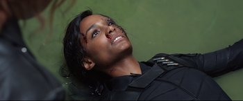 Movie still from “Black Widow” (2021), directed by Cate Shortland – A man with a knife in his face and blood on his face; Close Up shot, Overhead angle