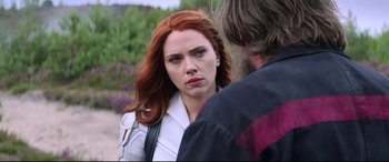 Movie still from “Black Widow” (2021), directed by Cate Shortland – A woman with long red hair is looking at a man with long red hair; Close Up shot, Over the shoulder angle