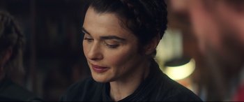 Movie still from “Black Widow” (2021), directed by Cate Shortland – A person with a black shirt; Close Up shot, Over the shoulder angle