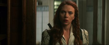 Movie still from “Black Widow” (2021), directed by Cate Shortland – A person holding a knife; Close Up shot, Over the shoulder angle