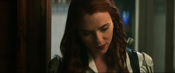 Movie still from “Black Widow” (2021), directed by Cate Shortland – A person with long red hair; Close Up shot, Low angle