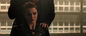 Movie still from “Black Widow” (2021), directed by Cate Shortland – A woman getting her hair cut by a man; Close Up shot, Over the shoulder angle