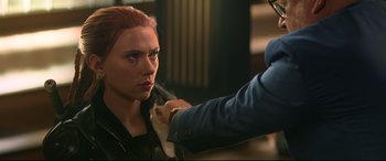 Movie still from “Black Widow” (2021), directed by Cate Shortland – A woman getting her hair cut by a stylist; Close Up shot, Over the shoulder angle
