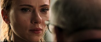 Movie still from “Black Widow” (2021), directed by Cate Shortland – A person looking at a mirror; Close Up shot, Over the shoulder angle