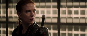 Movie still from “Black Widow” (2021), directed by Cate Shortland – A person holding a sword; Close Up shot, Over the shoulder angle