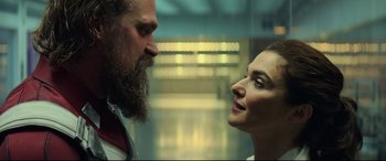 Movie still from “Black Widow” (2021), directed by Cate Shortland – A man and a woman face to face in an elevator; Close Up shot, Low angle