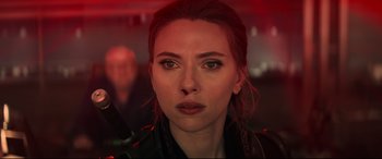 Movie still from “Black Widow” (2021), directed by Cate Shortland – A person with red hair; Close Up shot, Over the shoulder angle